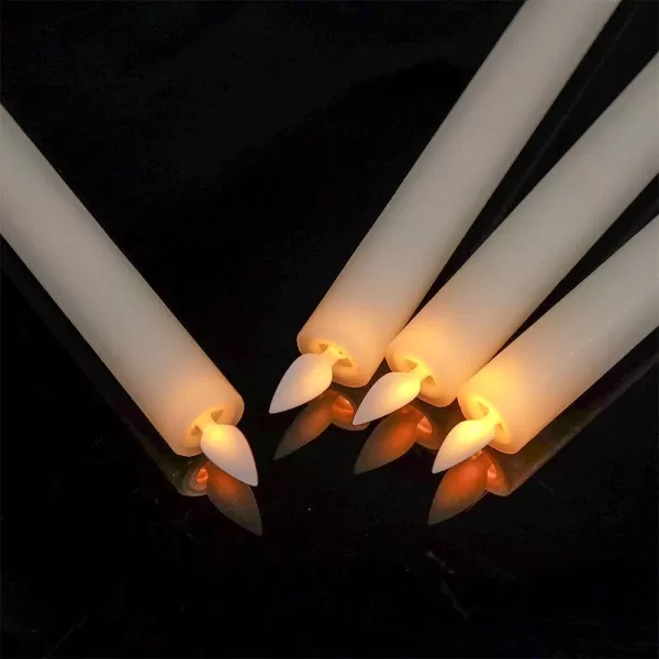 Eldnacele Flameless Flickering Taper Candles with Remote and Timer Window Candles Warm Real Wax Unscented 952 Pack White for Home Wedding Party Christmas Decoration4 Pack Ivory