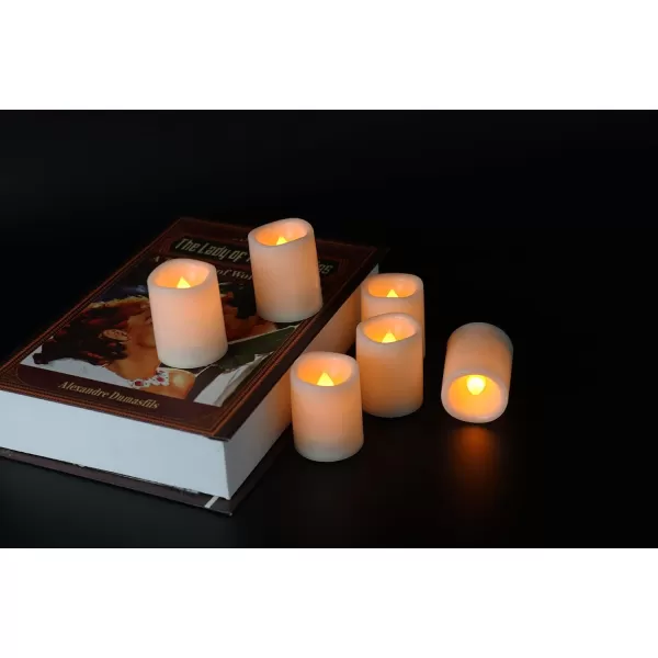 Eldnacele Flameless Flickering Votive Candles with Remote Battery Operated Remote Votive Candles Light 10 Pack LED Realistic Warm White Flame Decorative White CandlesD15 xH26 Pack
