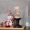 imageEldnacele Halloween Snow Globe Candles Lighted Lamp USB Powered Battery Operated Spooky Spinning Water Glittering Tornado Flameless Candles Skeleton Hand Holder Halloween Centerpiece DecorCastleCsnowman