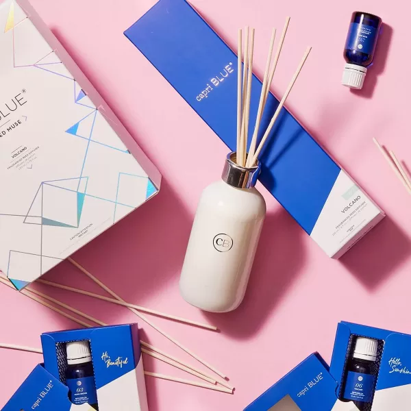 Capri Blue Reed Oil Diffuser  Volcano  Comes with Diffuser Sticks Oil and Glass Bottle  Aromatherapy Diffuser  8 Fl Oz  Navy BlueVolcano  White