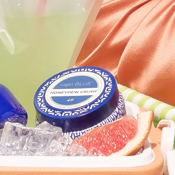 Capri Blue Honeydew Crush Scented Candle  Signature Printed Travel Tin Jar Candle  Luxury Aromatherapy Candle with a Soy Wax Blend  Blue Candle 85 oz