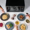 imageFarberware Countertop Microwave 1000 Watts 11 cu ft  Microwave Oven With LED Lighting and Child Lock  Perfect for Apartments and Dorms  Easy Clean Metallic RedBlack Stainless