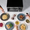 imageFarberware Countertop Microwave 700 Watts 07 Cu Ft  Microwave Oven With LED Lighting and Child Lock  Perfect for Apartments and Dorms  Easy Clean Grey Interior Retro BlackStainless Steel