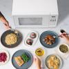 imageFarberware Countertop Microwave 700 Watts 07 Cu Ft  Microwave Oven With LED Lighting and Child Lock  Perfect for Apartments and Dorms  Easy Clean Grey Interior Retro BlackWhite