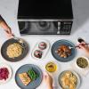 imageFarberware Countertop Microwave 700 Watts 07 Cu Ft  Microwave Oven With LED Lighting and Child Lock  Perfect for Apartments and Dorms  Easy Clean Grey Interior Retro BlackStainless Steel