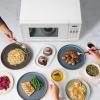 imageFarberware Countertop Microwave 700 Watts 07 Cu Ft  Microwave Oven With LED Lighting and Child Lock  Perfect for Apartments and Dorms  Easy Clean Grey Interior Retro BlackWhite