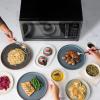 imageFarberware FMO11AHTBKBD1 Countertop 1000 Watts Microwave Oven with LED Lighting and Child LockPerfect for Apartments and DormsEasy Clean 11 cu ft Stainless Steel12 Cu Ft Black Stainless Grill