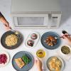 imageFarberware FMO11AHTBKBD1 Countertop 1000 Watts Microwave Oven with LED Lighting and Child LockPerfect for Apartments and DormsEasy Clean 11 cu ft Stainless Steel13 Cu Ft StainlessWhite Sensor