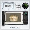 imageNostalgia Retro Compact Countertop Microwave Oven  07 Cu Ft  700Watts with LED Digital Display  Child Lock  Easy Clean Interior  OrangeBlack