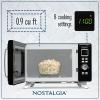 imageNostalgia Retro Compact Countertop Microwave Oven  07 Cu Ft  700Watts with LED Digital Display  Child Lock  Easy Clean Interior  OrangeBlack