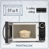 imageNostalgia Retro Compact Countertop Microwave Oven  07 Cu Ft  700Watts with LED Digital Display  Child Lock  Easy Clean Interior  OrangeBlack