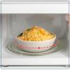 imageNostalgia Retro Compact Countertop Microwave Oven  07 Cu Ft  700Watts with LED Digital Display  Child Lock  Easy Clean Interior  OrangeBlack