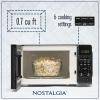 imageNostalgia Retro Compact Countertop Microwave Oven  07 Cu Ft  700Watts with LED Digital Display  Child Lock  Easy Clean Interior  OrangeBlack