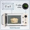 imageNostalgia Retro Compact Countertop Microwave Oven  07 Cu Ft  700Watts with LED Digital Display  Child Lock  Easy Clean Interior  OrangeIvory