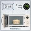 imageNostalgia Retro Compact Countertop Microwave Oven  07 Cu Ft  700Watts with LED Digital Display  Child Lock  Easy Clean Interior  OrangeIvory