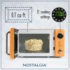 imageNostalgia Retro Compact Countertop Microwave Oven  07 Cu Ft  700Watts with LED Digital Display  Child Lock  Easy Clean Interior  OrangeOrange