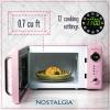 imageNostalgia Retro Compact Countertop Microwave Oven  07 Cu Ft  700Watts with LED Digital Display  Child Lock  Easy Clean Interior  OrangePink