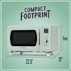 imageNostalgia Retro Compact Countertop Microwave Oven  07 Cu Ft  700Watts with LED Digital Display  Child Lock  Easy Clean Interior  OrangeSeafoam Green