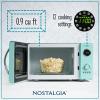 imageNostalgia Retro Compact Countertop Microwave Oven  07 Cu Ft  700Watts with LED Digital Display  Child Lock  Easy Clean Interior  OrangeTeal