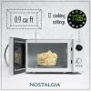 imageNostalgia Retro Compact Countertop Microwave Oven  07 Cu Ft  700Watts with LED Digital Display  Child Lock  Easy Clean Interior  OrangeWhite