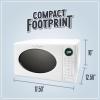 imageNostalgia Retro Compact Countertop Microwave Oven  07 Cu Ft  700Watts with LED Digital Display  Child Lock  Easy Clean Interior  OrangeWhite