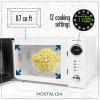imageNostalgia Retro Compact Countertop Microwave Oven  07 Cu Ft  700Watts with LED Digital Display  Child Lock  Easy Clean Interior  OrangeWhite