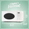 imageNostalgia Retro Compact Countertop Microwave Oven  07 Cu Ft  700Watts with LED Digital Display  Child Lock  Easy Clean Interior  OrangeWhite