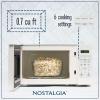 imageNostalgia Retro Compact Countertop Microwave Oven  07 Cu Ft  700Watts with LED Digital Display  Child Lock  Easy Clean Interior  OrangeWhite