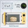 imageNostalgia Retro Compact Countertop Microwave Oven  07 Cu Ft  700Watts with LED Digital Display  Child Lock  Easy Clean Interior  OrangeYellow