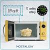 imageNostalgia Retro Compact Countertop Microwave Oven  07 Cu Ft  700Watts with LED Digital Display  Child Lock  Easy Clean Interior  OrangeYellow