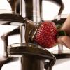 imageNostalgia 4 Tier Electric Chocolate Fondue Fountain Machine for Parties  Melts Cheese Queso Candy and Liqueur  Dip Strawberries Apple Wedges Vegetables and More  32Ounce  AquaStainless Fondue Fountain