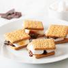 imageNostalgia Indoor Electric Stainless Steel SMores Maker with 4 Lazy Susan Compartment Trays for Graham Crackers Chocolate Marshmallows and 4 Roasting Forks BrownSmores Maker Brown