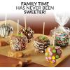 imageNostalgia Indoor Electric Stainless Steel SMores Maker with 4 Lazy Susan Compartment Trays for Graham Crackers Chocolate Marshmallows and 4 Roasting Forks BrownCaramel Apple Maker