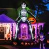 imageOurWarm 10 FT Inflatables Skeleton Halloween Decor Outdoor Giant Blow Up Decorations Holding Pumpkin Scary Halloween Inflatables Sitting Skeleton with Builtin LEDs for Rooftop Balcony Garden Party